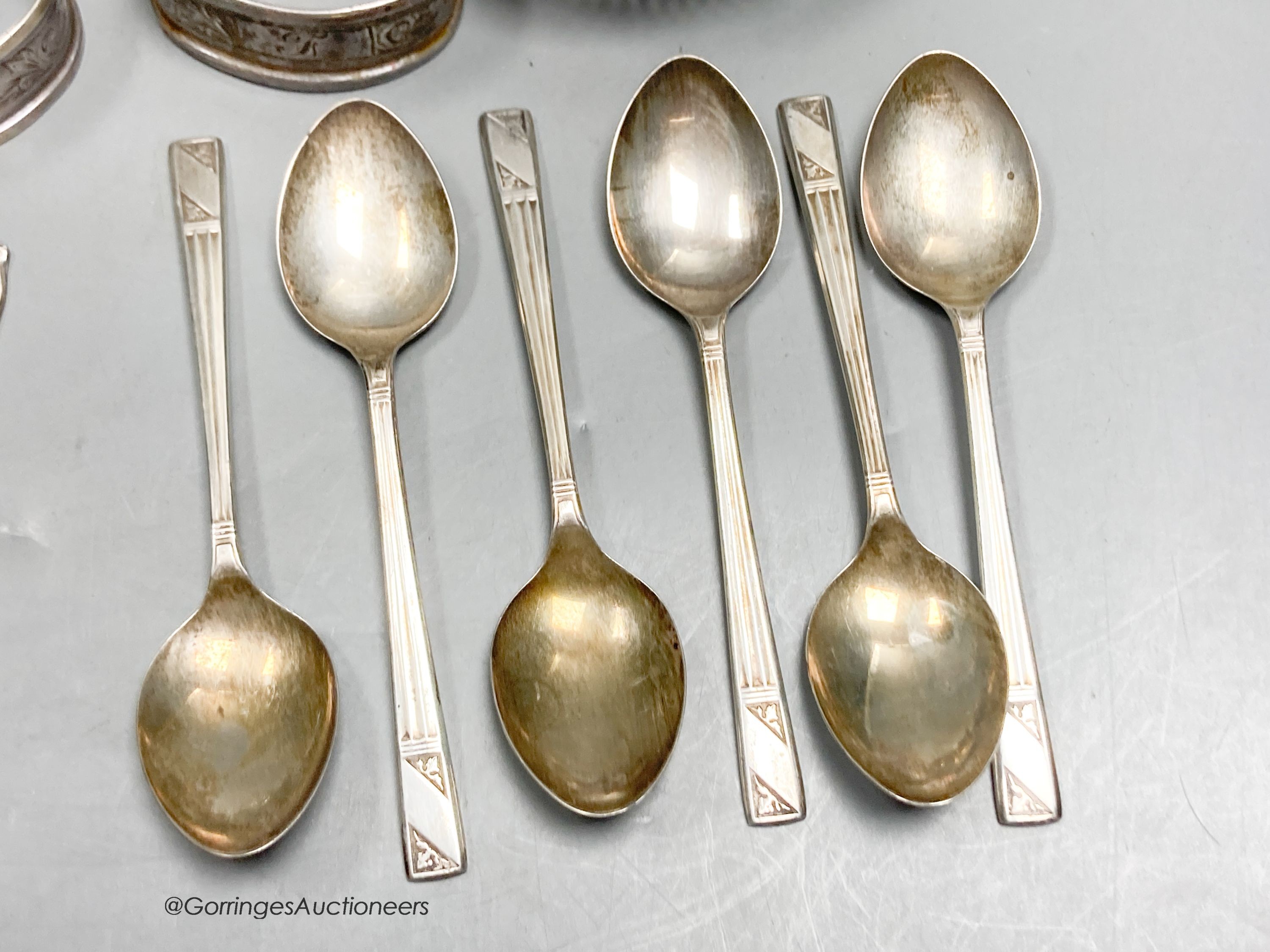 A pair of George III silver tablespoons, a pair of modern silver bottle coasters, a pair of pierced silver bon bon dishes, six silver teaspoons and 6 silver coffee spoons.